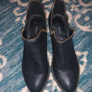 Black ankle booties with zipper detail